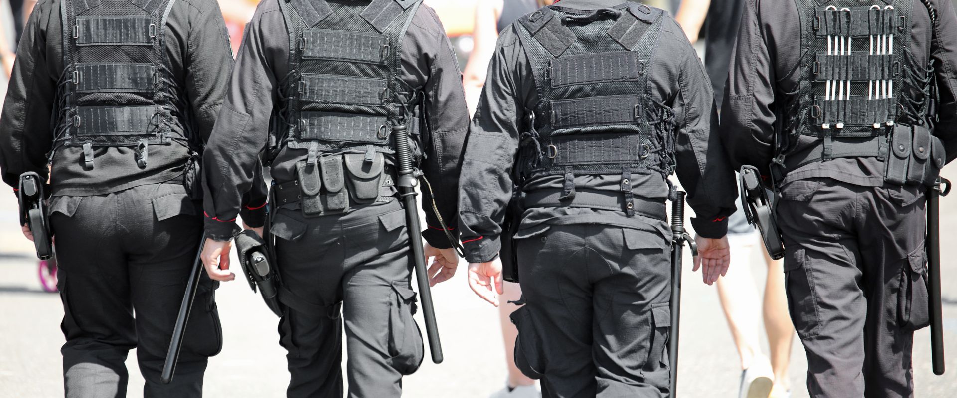 Law enforcement walking in protective gear